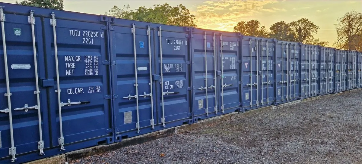 Row of blue self-storage containers at CamStorage near the A14